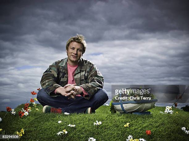 Chef Jamie Oliver poses for a portrait shoot for Penguin Books in London on June 26, 2007.