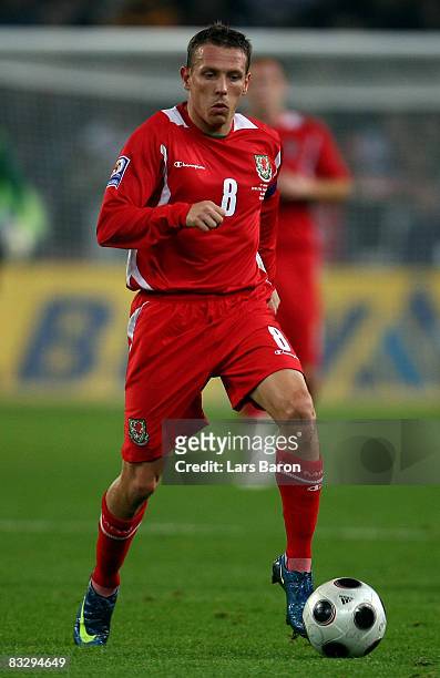Craig Bellamy of Wales runs with the ball during the FIFA 2010 World Cup Qualifier match between Germany and Wales at the Borussia Park on October...