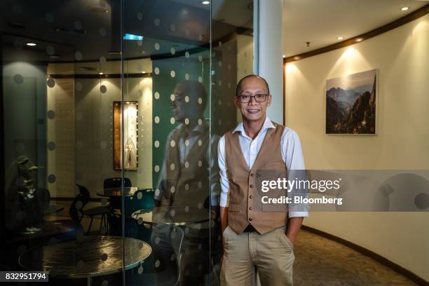 Lim Tze Cheng, chief executive officer of Inter-Pacific Asset Management Sdn., poses for a portrait in his office in Kuala Lumpur, Malaysia, on...