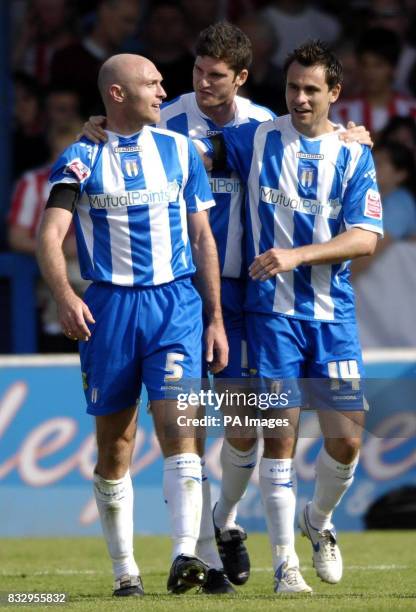 Colchester's Wayne Brown celebrates with team-mate Richard Garcia after scoring the opening goal against Sunderland during the Coca-Cola Football...