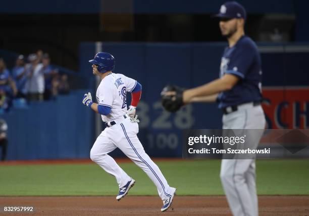 Steve Pearce of the Toronto Blue Jays circles the bases after hitting a solo home run in the fifth inning during MLB game action as Jacob Faria of...