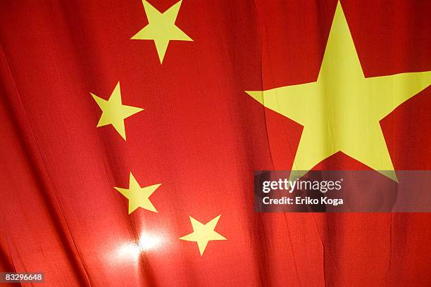 national flag of cinese fluttering in wind - chinese national flag stock pictures, royalty-free photos & images