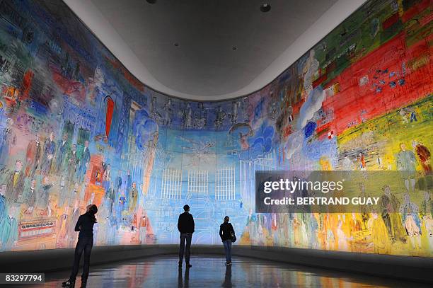 Woman looks at a fresco by French Fauvist painter Raoul Dufy entitled "La Fée électricité" , on October 16, 2008 during the exhibition "Raoul Dufy,...