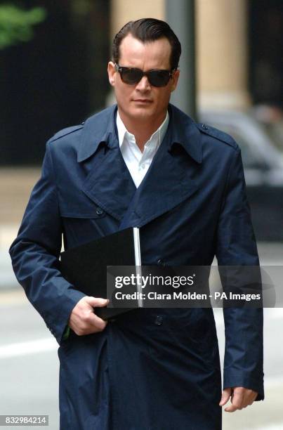 Banking heir Matthew Mellon arrives at Southwark Crown Court in London where he is accused of of spying on his former wife Tamara Mellon, who owns...