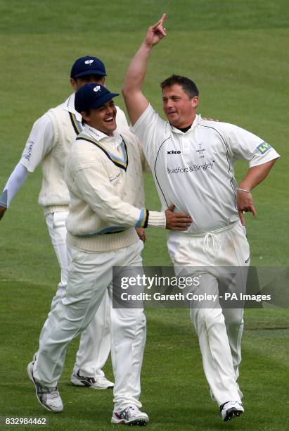 Yorkshire's Darren Gough celebrates with team-mate Jacques Rudolph after bowling Durham's Michael Di Venuto during the Liverpool Victoria County...