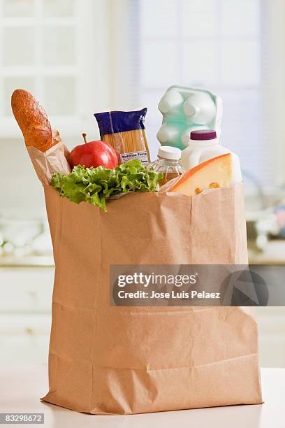 grocery bag full of groceries - grocery bag bildbanksfoton och bilder