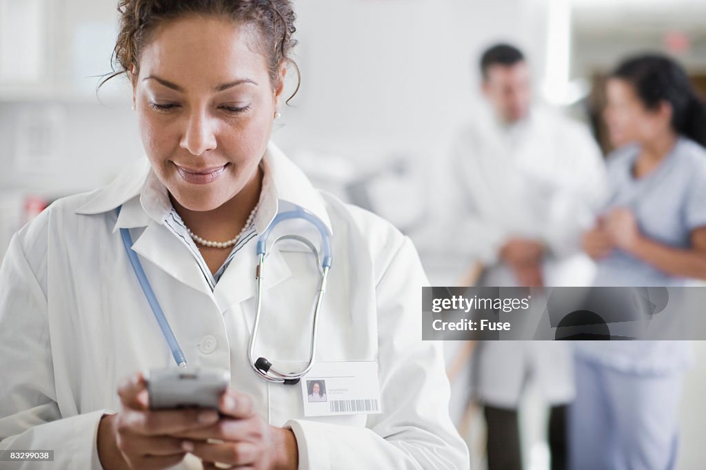 Doctor Text Messaging From Cell Phone High-Res Stock Photo - Getty Images