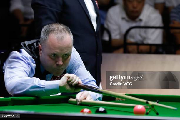 John Higgins of Scotland reacts during a qualifying match against Lyu Haotian of China on day one of Evergrande 2017 World Snooker China Champion at...