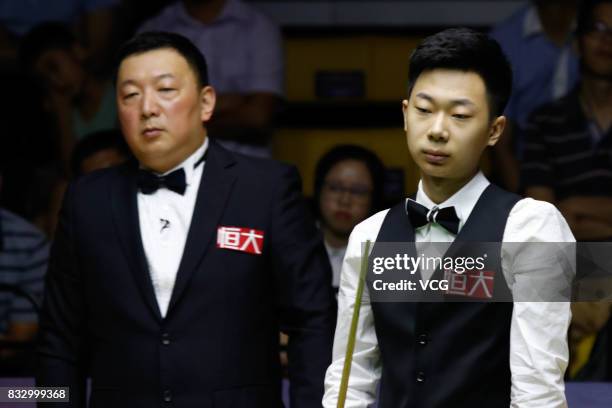 Lyu Haotian of China reacts during a qualifying match against John Higgins of Scotland on day one of Evergrande 2017 World Snooker China Champion at...