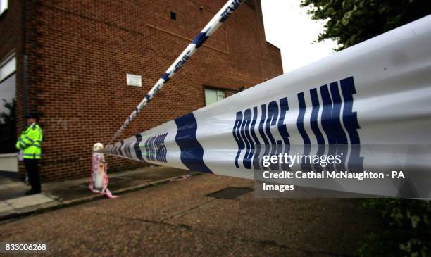 Police officer at the scene where a man was shot dead by police at 10.25pm last night, in Hanger Green in Ealing, west London.