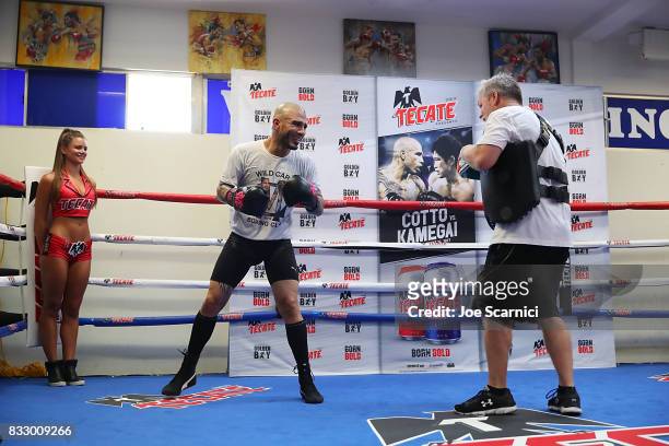 Miguel Cotto and Freddie Roach train during a media workout on August 16, 2017 in Los Angeles, California.