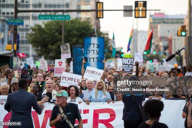 Demonstrators participate in a march and rally against white supremacy August 16, 2017 in downtown Philadelphia, Pennsylvania. Demonstrations are...