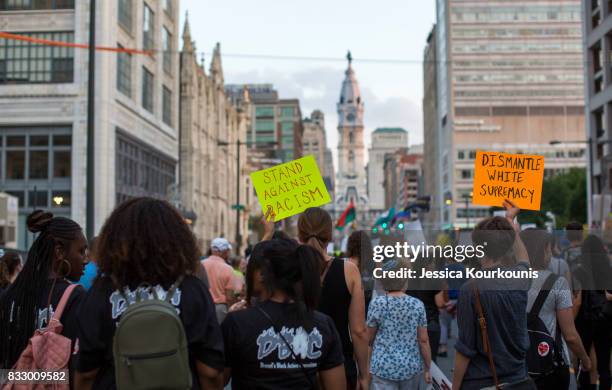 Demonstrators participate in a march and rally against white supremacy August 16, 2017 in downtown Philadelphia, Pennsylvania. Demonstrations are...