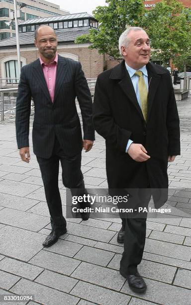 Taoiseach Bertie Ahern arrives with former Ireland footballer Paul McGrath for the unveiling of plans for a national sports museum at Custom House...