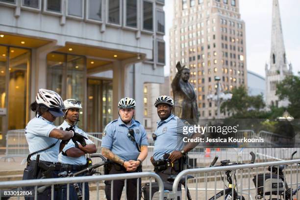Police officers guard a statue of former Philadelphia mayor Frank Rizzo as protesters march against white supremacy August 16, 2017 in downtown...