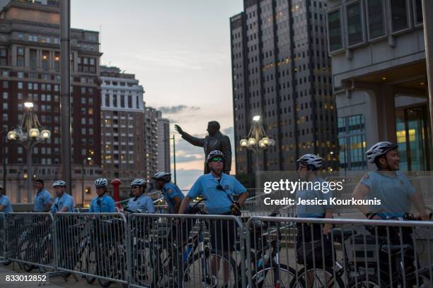 Police officers guard a statue of former Philadelphia mayor Frank Rizzo as protesters march against white supremacy August 16, 2017 in downtown...