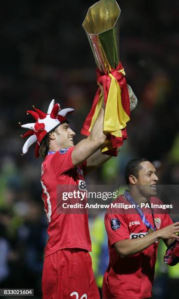 Sevilla's Ocio Aitor and Adriano celebrate winning the Uefa cup