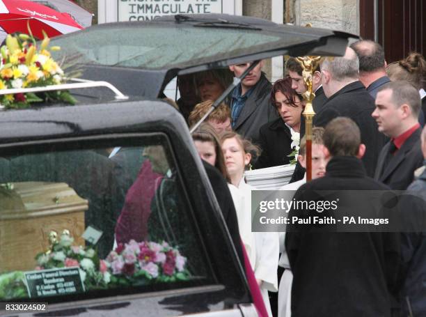 The bodies of Caitriona and Caitlin Innes are carried out of the Church of the Immaculate Conception in Bundoran, Co Donegal, following their funeral...