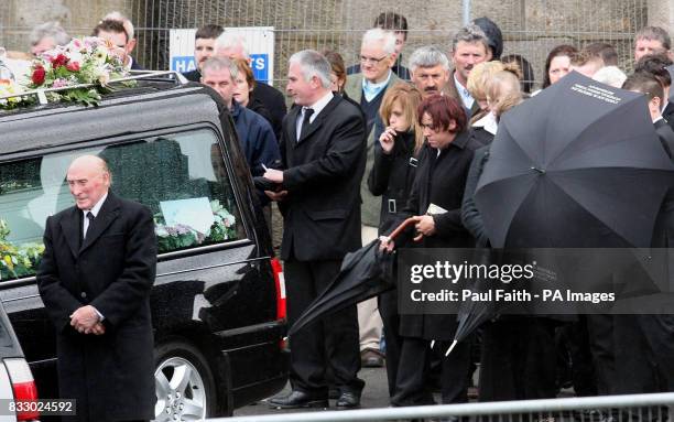 Mourners walk behind a hearse carrying the body of Caitlin Innes from the Church of the Immaculate Conception in Bundoran, Co Donegal, following her...