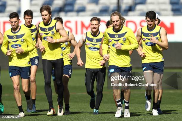 Cats players warm-up during a Geelong Cats AFL training session at Simonds Stadium on August 17, 2017 in Geelong, Australia.