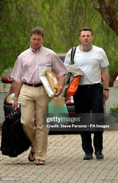 Gerry McCann returns to the apartment where he and his family are staying in Praia Da Luz, Portugal, after a short visit to the UK.