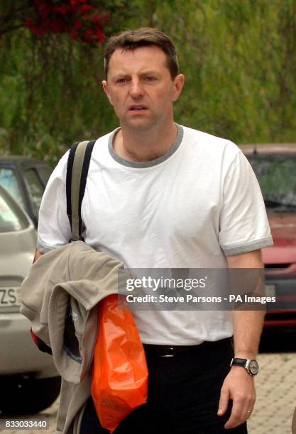 Gerry McCann returns to the apartment where he and his family are staying in Praia Da Luz, Portugal, after a short visit to the UK.