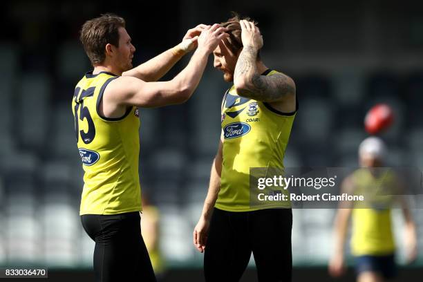 Patrick Dangerfield of the Cats plays with the hair of Zach Tuohy during a Geelong Cats AFL training session at Simonds Stadium on August 17, 2017 in...