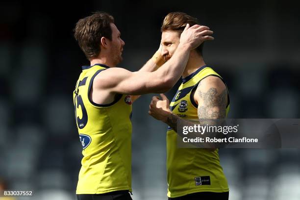 Patrick Dangerfield of the Cats plays with the hair of Zach Tuohy during a Geelong Cats AFL training session at Simonds Stadium on August 17, 2017 in...