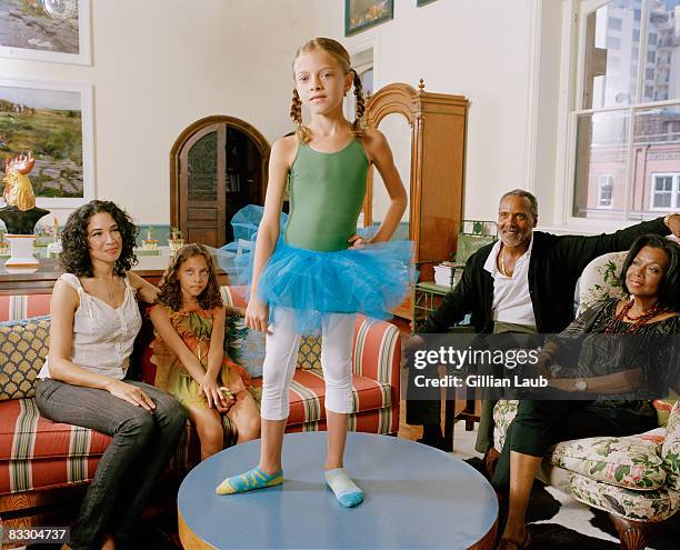 young girl dancing on coffee table to entertain he - senior man dancing on table stock pictures, royalty-free photos & images