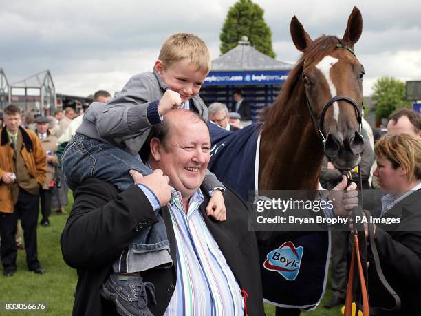 Finsceal Beo with Owner Michael Ryan and his Grandson Anthony Grehan after jockey Kevin Manning won the Boylesports Irish 1,000 Guineas at Curragh...