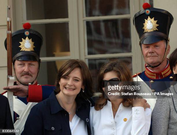 Partners of G8 leaders; Cherie Blair and Margarida Uva pose for a photo outside the Town Hall in the historical town of Wismar on the first day of...