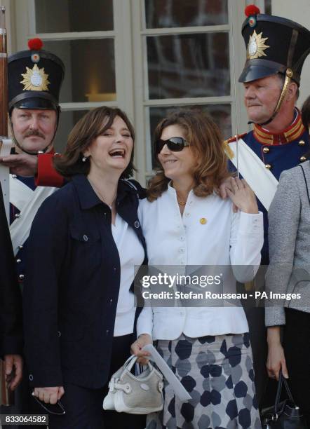 Partners of G8 leaders; Cherie Blair and Margarida Uva pose for a photo outside the Town Hall in the historical town of Wismar on the first day of...