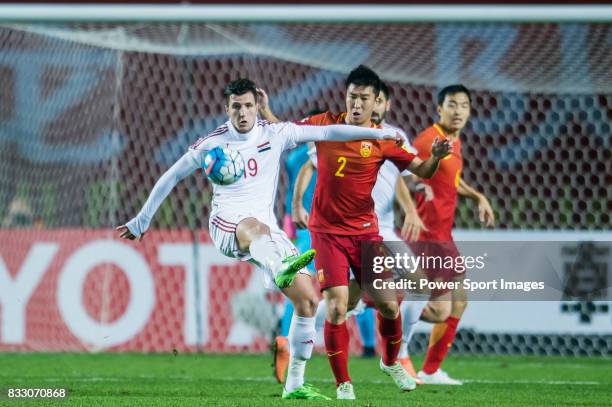 Mohamad Muhtadi of Syria fights for the ball with Ren Hang of China PR during their 2018 FIFA World Cup Russia Final Qualification Round Group A...