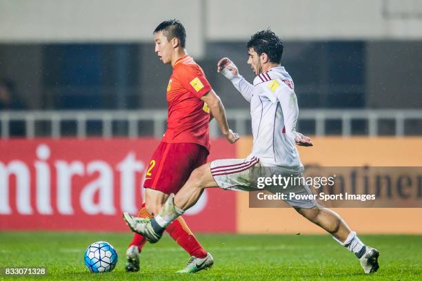 Ren Hang of China PR fights for the ball with Kahled Almbayed of Syria during their 2018 FIFA World Cup Russia Final Qualification Round Group A...