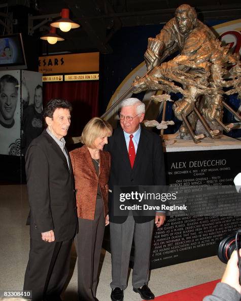 Mike Ilitch and Marian Ilitch stand next to Alex Delvecchio at the