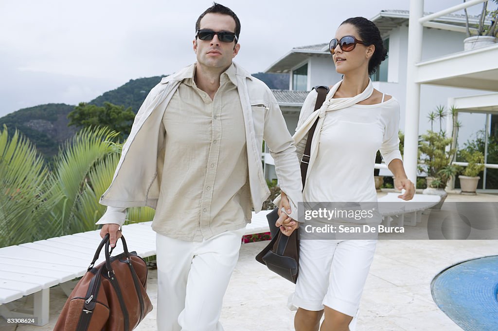 Glamorous couple rushing