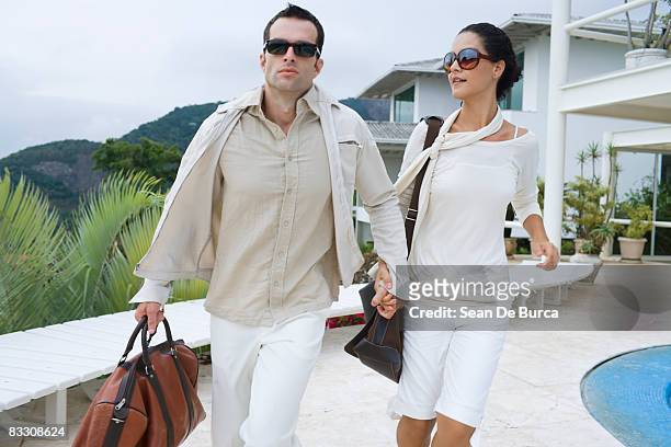 glamorous couple rushing - socialite stock pictures, royalty-free photos & images