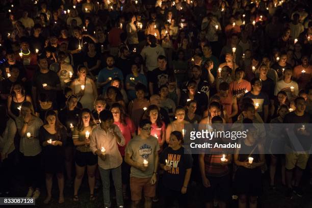 Thousands gather with candles to march along the path that White Supremacists took the prior Friday with torches on the University of Virginia Campus...