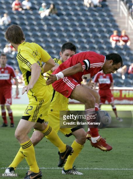 Cuauhtemoc Blanco of the Chicago Fire tries to keep the ball away from Eddie Gavin and Danny O'Rourke of the Columbus Crew during the first half at...