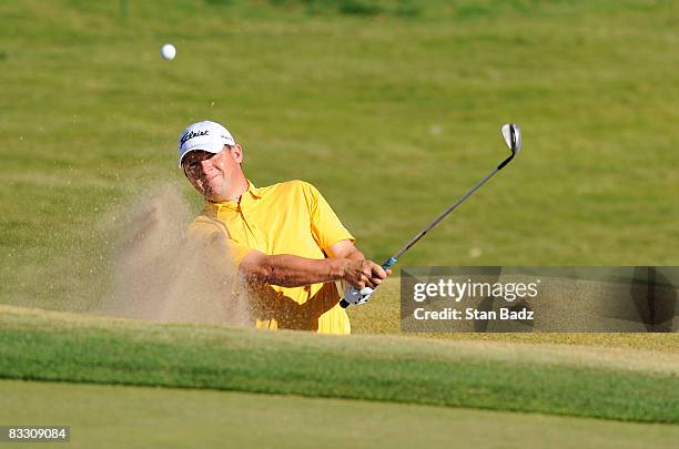 Jon Mills hits out of the bunker at the ninth green during the first round of the Justin Timberlake Shriners Hospitals for Children Open held at TPC...