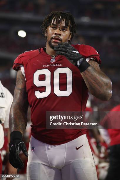 Defensive tackle Robert Nkemdiche of the Arizona Cardinals watches from the sidelines during the NFL game against the Oakland Raiders at the...