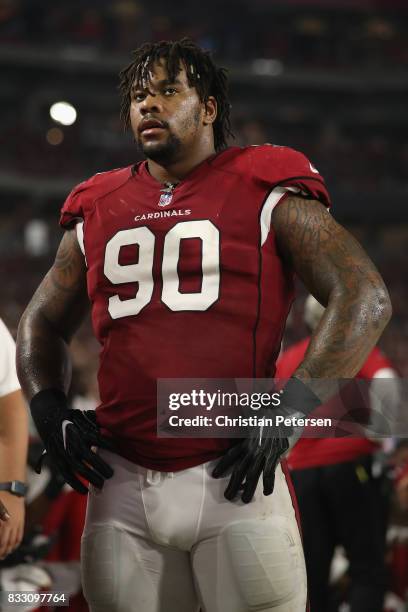 Defensive tackle Robert Nkemdiche of the Arizona Cardinals watches from the sidelines during the NFL game against the Oakland Raiders at the...