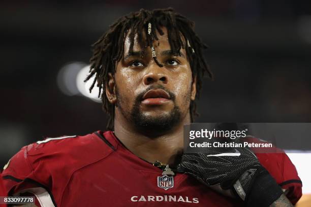 Defensive tackle Robert Nkemdiche of the Arizona Cardinals watches from the sidelines during the NFL game against the Oakland Raiders at the...