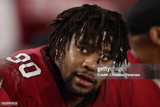 Defensive tackle Robert Nkemdiche of the Arizona Cardinals watches from the sidelines during the NFL game against the Oakland Raiders at the...