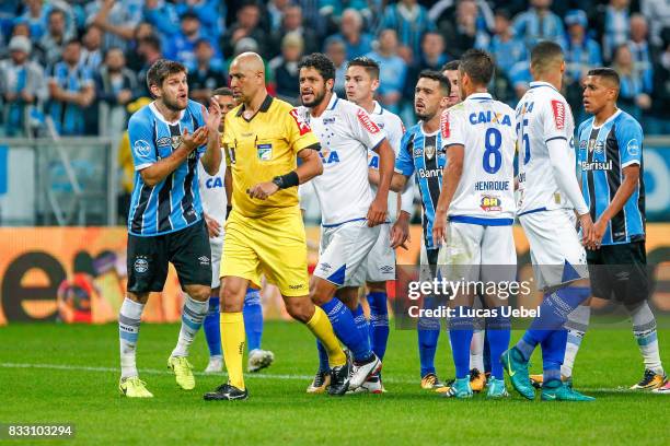 Players of Gremio and Cruzeiro argue with the referee Marcelo de Lima Henrique during the Gremio v Cruzeiro match, part of Copa do Brasil Semi-Finals...