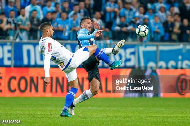 Lucas Barrios of Gremio battles for the ball against Murilo of Cruzeiro during the Gremio v Cruzeiro match, part of Copa do Brasil Semi-Finals 2017,...