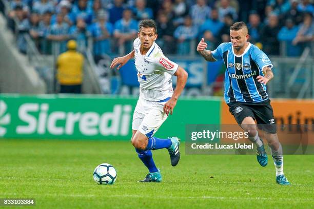 Luan of Gremio battles for the ball against Henrique of Cruzeiro during the Gremio v Cruzeiro match, part of Copa do Brasil Semi-Finals 2017, at...