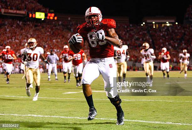 Tight end Anthony Hill of the North Carolina State Wolfpack runs in for a touchdown against the Florida State Seminoles during the game at...