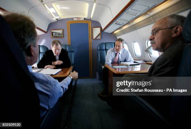 Previously unreleased photo of Prime Minister Tony Blair on route to Warsaw to aboard the Royal Flight with Official Spokesman Tom Kelly and Director...