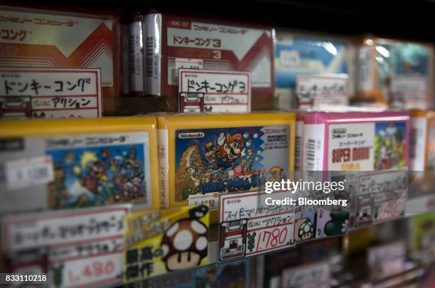 Video games cartridges for the Nintendo Co. Nintendo Entertainment System /Famicom console are displayed for sale at the Super Potato video game...